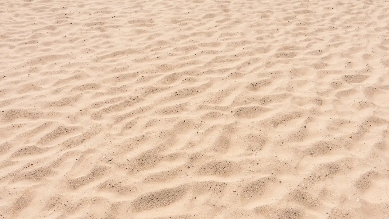 O que existe por baixo de toda a areia do mundo?